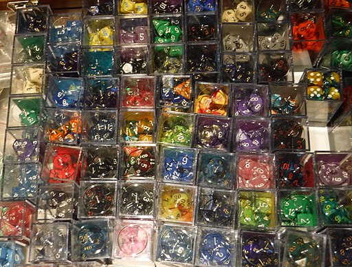 trays of multi-colored, multi-sided dice